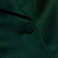 Close-up of a forest green Chamberlain Satin Blazer showing the fabric-covered button and lapel.