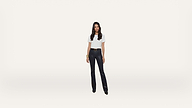 A woman stands facing forward, wearing a white short-sleeve top, black pants, and black shoes. She has long, dark hair and a gold bracelet, posing against a plain white background.