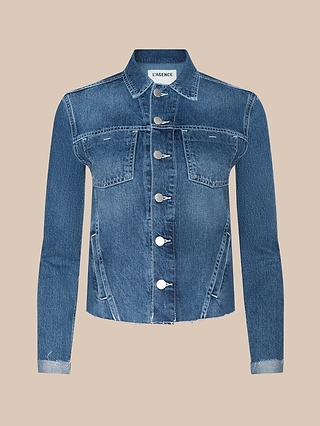 The Janelle Jean Jacket is a slim fit blue denim jacket featuring silver buttons, two chest pockets, and long sleeves, displayed on a beige background.