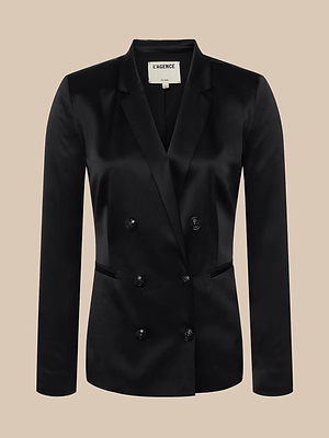 The Colin Silk Charmeuse Blazer is a tailored black double-breasted jacket with peak lapels and two front pockets, shown against a neutral beige background.