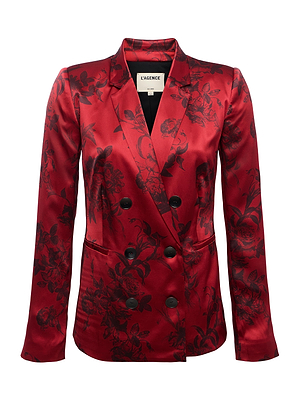 A shiny red Colin Silk Blazer by L'AGENCE, crafted in satin with a double-breasted design, black floral pattern, notched collar, and elegant buttons.