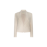 The Brooke Tweed Blazer is a cream-colored, double-breasted women’s blazer featuring long sleeves, two front pockets, and a notched lapel, shown against a plain white background.