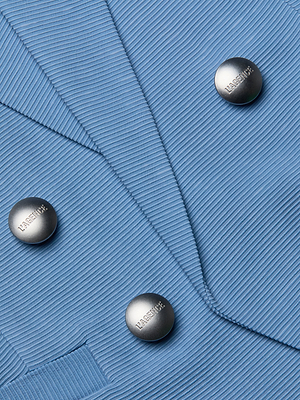 Close-up of the Brooke Blazer in light blue, featuring three metallic HARMONIC buttons. Made from lightweight, finely textured ribbed fabric with a visible pocket detail.