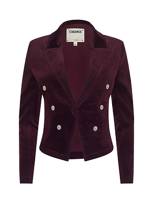 The Wayne Velvet Blazer by L'AGENCE is maroon with a tailored fit, long sleeves, a peaked lapel, and six silver buttons in a double-breasted design.