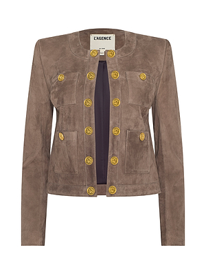 The Jayde Collarless Jacket is a taupe suede piece with long sleeves, two front pockets, double rows of gold buttons, and an open front. Perfect for layering. Label reads LAGENCE.