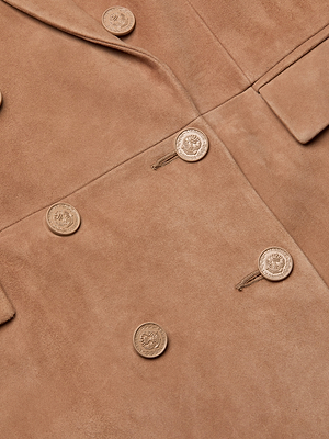 Close-up of the Aimee Oversized Suede Blazer in tan suede, showcasing large embossed gold buttons, soft fabric texture, buttonholes, and a pocket flap.