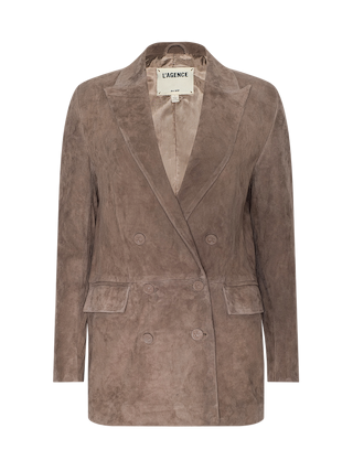 Brown suede double-breasted blazer with wide lapels and front flap pockets, displayed on a plain white background. The inner label reads L’AGENCE. This versatile piece layers beautifully over the Arabell Romper, making it an elevated essential for warm weather style.