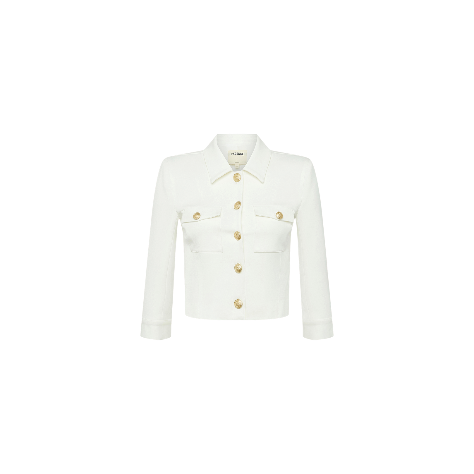 Introducing the Kumi Cropped Jacket—a white jacket crafted from stretch-suiting fabrication, designed with gold embossed dome buttons down the front, long sleeves, and two chest pockets. Displayed on a plain white background.