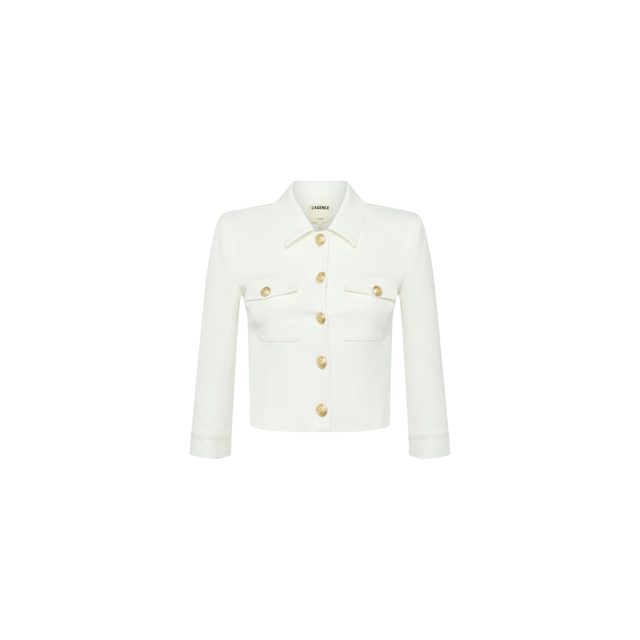 Introducing the Kumi Cropped Jacket—a white jacket crafted from stretch-suiting fabrication, designed with gold embossed dome buttons down the front, long sleeves, and two chest pockets. Displayed on a plain white background.