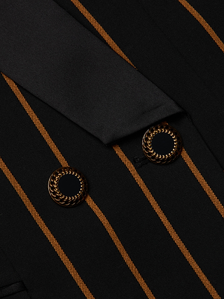Close-up of the Imogen Satin Lapel Blazer in black with diagonal brown stripes, showcasing two gold and black decorative buttons and a coordinating satin lapel.