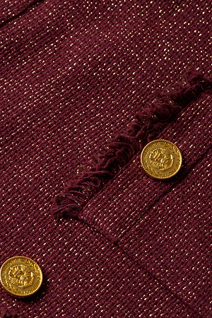 Close-up of the L'AGENCE Sylvia Tweed Jacket in burgundy Italian tweed with metallic gold threads, gold buttons, and fringed trims.