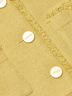 Close-up of the Sylvia Tweed Jacket, featuring textured yellow tweed, fringed trims, and four round gold buttons engraved with LAGENCE.