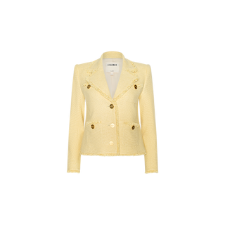 The Sylvia Tweed Jacket is a light yellow tailored tweed piece featuring embossed gold buttons, front pockets, and subtle fringed trims on the collar and cuffs. The label inside reads LAGENCE. It is photographed against a plain white background.
