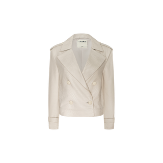 The Xoey Cropped Leather Trench Coat features an off-white, double-breasted design crafted from textured leather with large lapels, button details, and shoulder epaulets. Reminiscent of a classic trench coat in a cropped silhouette, the jacket is displayed against a plain white background.