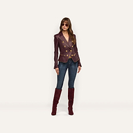 A woman creates an hourglass silhouette in a burgundy double-breasted Ottilie Leather Blazer with gold buttons, dark-wash jeans, and matching knee-high suede boots for a look of power dressing.