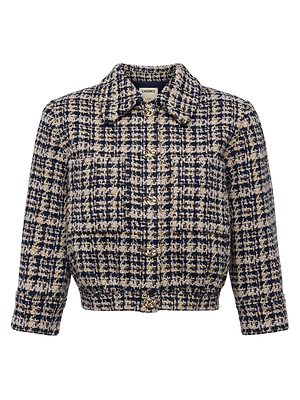 The Jia Tweed Jacket by L'AGENCE features a navy blue and beige plaid textured design with front buttons, a collar, long sleeves, and a cropped, boxy fit for a chic blend of classic and modern style.