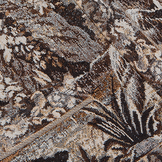 Close-up of textured brown and beige Italian jacquard fabric featuring the intricate, abstract floral and foliage pattern of the Lian Tapestry Jacket—clusters of flowers and leaves woven into the material, with visible diagonal seams that add to its heirloom elegance.