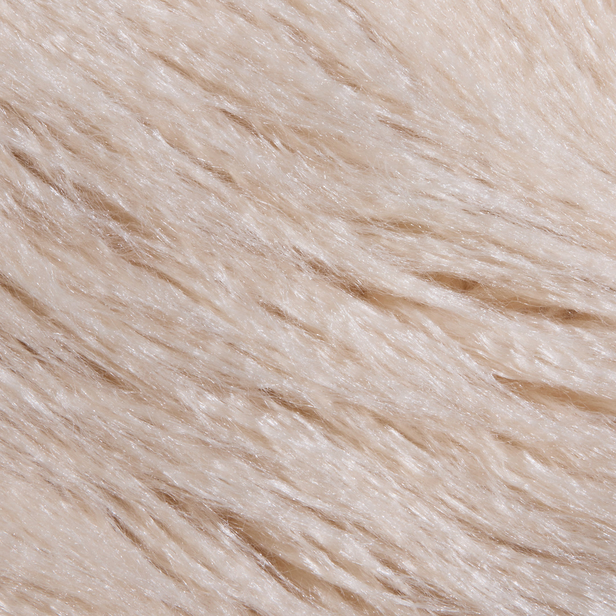 Close-up of the Toira Faux Fur Coat, showcasing its soft, light beige faux fur with fine, smooth strands all neatly aligned in one direction, creating a fluffy and silky texture reminiscent of vintage-inspired 70s rockstar style.