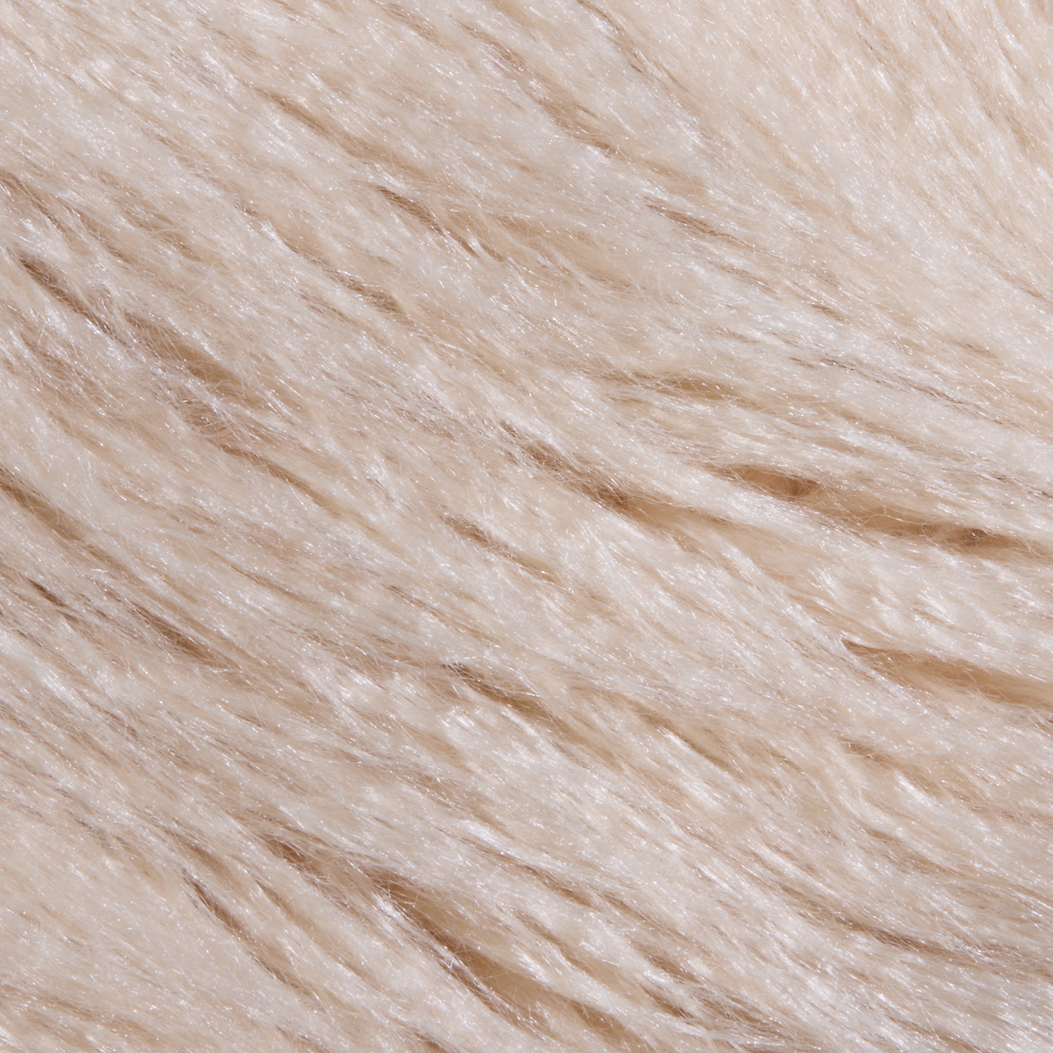 Close-up of the Toira Faux Fur Coat, showcasing its soft, light beige faux fur with fine, smooth strands all neatly aligned in one direction, creating a fluffy and silky texture reminiscent of vintage-inspired 70s rockstar style.