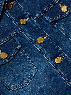 Close-up of the Koda Cropped Jean Jacket by L'AGENCE in dark wash denim, featuring gold buttons, a chest pocket, and detailed stitching that highlights its textured finish.