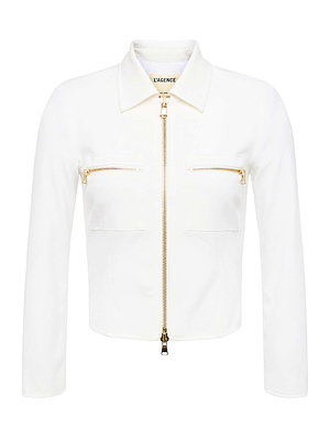 The Calianna Shirt Jacket by L'AGENCE features long sleeves, white stretch suiting fabric, a front zipper, two chest pockets with gold zippers, and a classic collar with the L'AGENCE label inside.