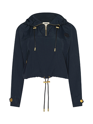 The Bronwyn Cropped Windbreaker is a navy blue, hooded, water-repellent jacket with a front zipper, gold-tone accents, buttoned cuffs, and adjustable drawstrings at the waist and hood for a relaxed, sporty look.