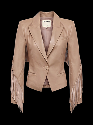 A light brown faux leather blazer with long fringe detailing along the sleeves, notched lapels, a single button closure, and a label reading L’AGENCE on the inside collar. The background is black.