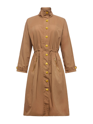 The Toshi Windbreaker by L'AGENCE is a long, tan-brown water-repellent coat with a high collar, gold front buttons, two zippered side pockets, a gathered waist, and matching gold buttoned cuffs.