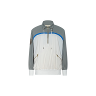 The Aurelia Windbreaker is a long-sleeve, color-block nylon jacket featuring grey shoulders and sleeves, a white front, blue accent, gold zippered pockets, and a half-zip collar. Displayed on a plain white background, this retro windbreaker combines athleisure style with practical design.