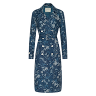 The Bradley Linen Trench Coat is a blue, double-breasted trench coat featuring a belted waist and white floral print—this classic outer layer blends elegance and versatility, shown against a plain white background.