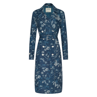 The Bradley Linen Trench Coat is a blue, double-breasted trench coat featuring a belted waist and white floral print—this classic outer layer blends elegance and versatility, shown against a plain white background.