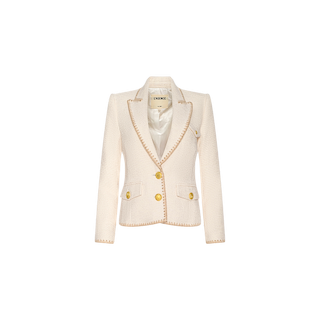 The Wylla Tweed Blazer is an elegant cream-hued ecru blazer, highlighted by beige embroidered trim, gold buttons, and two front pockets, displayed against a plain white background.