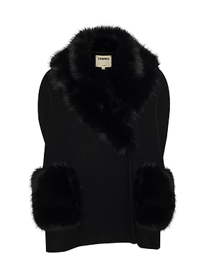 The Chana Faux Fur Cape by L'AGENCE is a black poncho-style garment in recycled wool blend, featuring a wide faux fur collar and large faux fur-trimmed pockets for an elegant, luxurious look.
