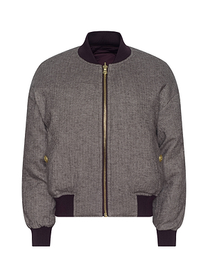 The Violeta Reversible Puffer by L'AGENCE is a gray quilted satin bomber jacket with a front gold zipper, two side buttons, and dark ribbed cuffs, collar, and waistband, shown on a white background.