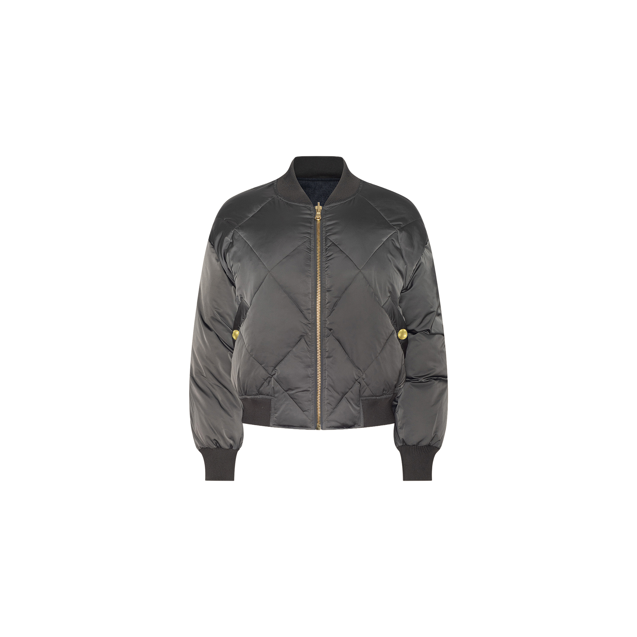 The Violeta Reversible Puffer is a black quilted satin bomber jacket featuring a front zipper, ribbed cuffs and hem, and two side pockets, shown against a white background.