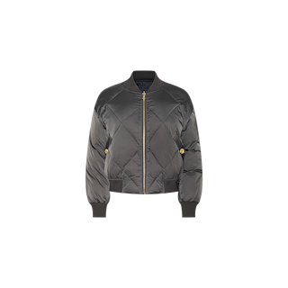 The Violeta Reversible Puffer is a black quilted satin bomber jacket featuring a front zipper, ribbed cuffs and hem, and two side pockets, shown against a white background.
