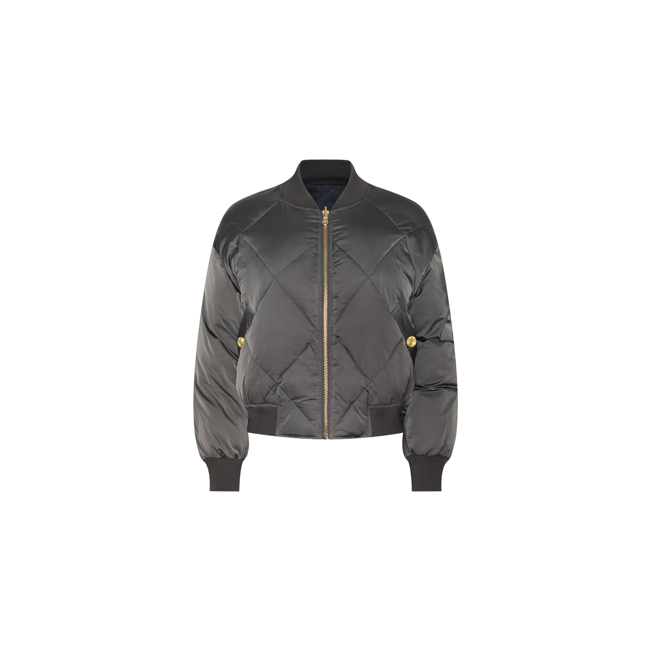 The Violeta Reversible Puffer is a black quilted satin bomber jacket featuring a front zipper, ribbed cuffs and hem, and two side pockets, shown against a white background.