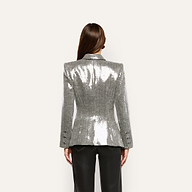 Back view of a person wearing a silver, double-breasted Kyomi Sequined Blazer with structured shoulders and black trousers.