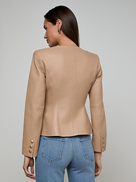 Wearing the Mariella Leather Jacket—designed without a collar and featuring button details on the sleeves—a woman in blue jeans stands with her back to the camera against a simple light background.