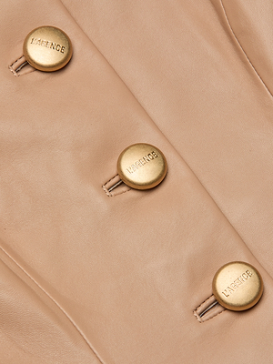 Close-up of the Mariella Leather Jacket in light beige cappuccino leather, featuring three gold LAGENCE buttons sewn in a neat vertical line.