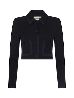 The Blythe Cropped Jacket is a black, long-sleeve blazer featuring a collar, button front, and two front pockets. With its sleek and modern design, this versatile piece offers elevated style for any occasion.