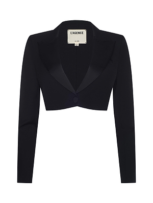 The Daxton Cropped Blazer by L’AGENCE is a black, tailored piece with long sleeves, a single-button closure, and a satin lapel—perfect for sleek evening style. A label inside the collar reads L’AGENCE.