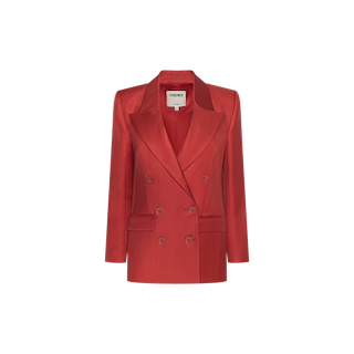 The Cambrie Oversized Blazer is a statement piece, featuring a double-breasted design in red linen with wide lapels and long sleeves, showcased against a plain white background.