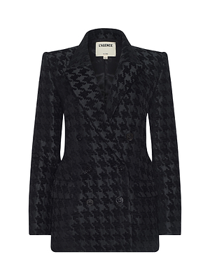 The Cambrie Oversized Houndstooth Blazer features a black houndstooth pattern, double-breasted front, notched lapels, flap pockets, and is crafted from Italian chenille. LAGENCE label appears inside the collar.