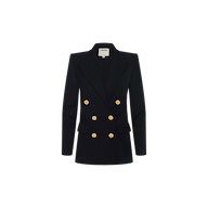 The Cambrie Oversized Blazer is a black double-breasted blazer featuring gold buttons, two front pockets, and a structured fit. Crafted from stretch suit fabric, it is displayed on a plain white background.