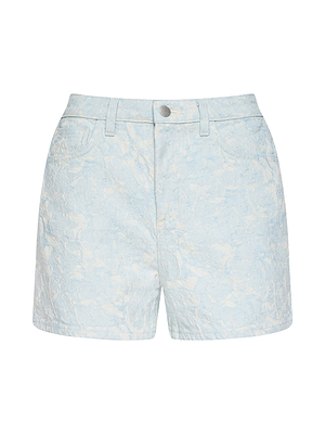 The Lissania Jacquard Short features light blue, coastal-inspired cotton jacquard with a subtle floral pattern, front button and zip closure, belt loops, and side pockets, shown on a plain white background.