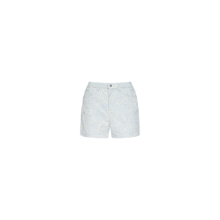 The Lissania Jacquard Short showcases light blue denim with a subtle white floral print, crafted from textured cotton jacquard. Designed with a high rise, front zipper, and button closure, these coastal-inspired shorts are photographed against a plain white background.