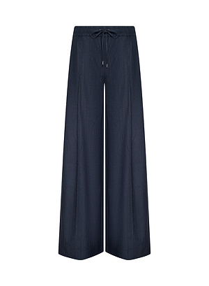 The Connie Drawstring Trouser features wide-leg navy blue styling in lightweight fabric with a relaxed fit and subtle vertical texture, echoing Fall 2026 New York Fashion Week trends. Shown on a plain white background.