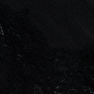 Close-up of black lace fabric against a solid black background, featuring delicate floral patterns and intricate texture along the left and bottom edges—reminiscent of the refined detailing found in the Mirel Satin Lace Pant.