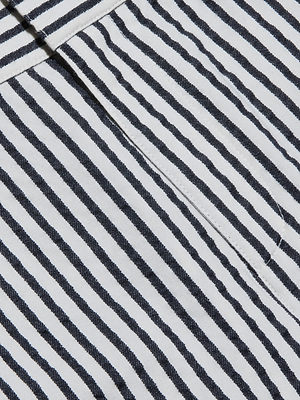 Close-up of black and white diagonal stripes on cotton seersucker fabric with a vertical stitched seam, featured on the Leni Pedal Pusher.